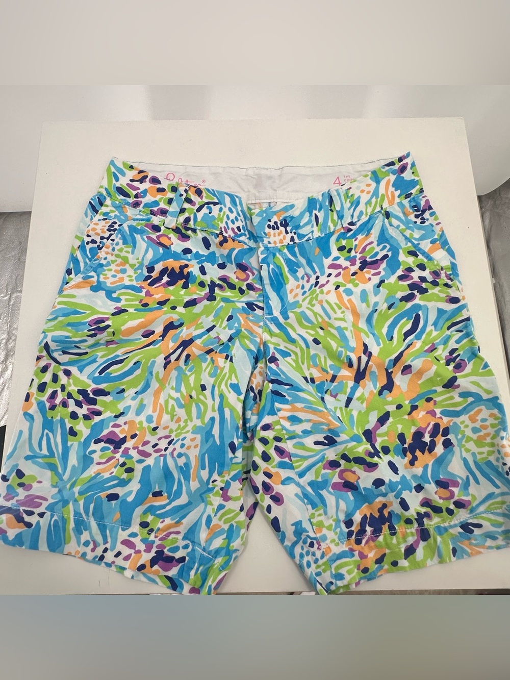 Lilly Pulitzer Chipper Bermuda-style shorts in a vibrant blue, green, and purple
